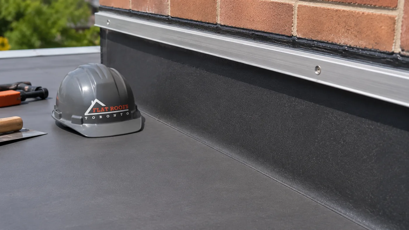 Close up of a repaired membrane seam and flashing after flat roof repair on a Mississauga property