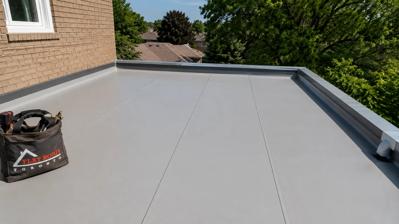 Newly installed flat roofing on a Whitby home showing a clean membrane surface and parapet edge detail