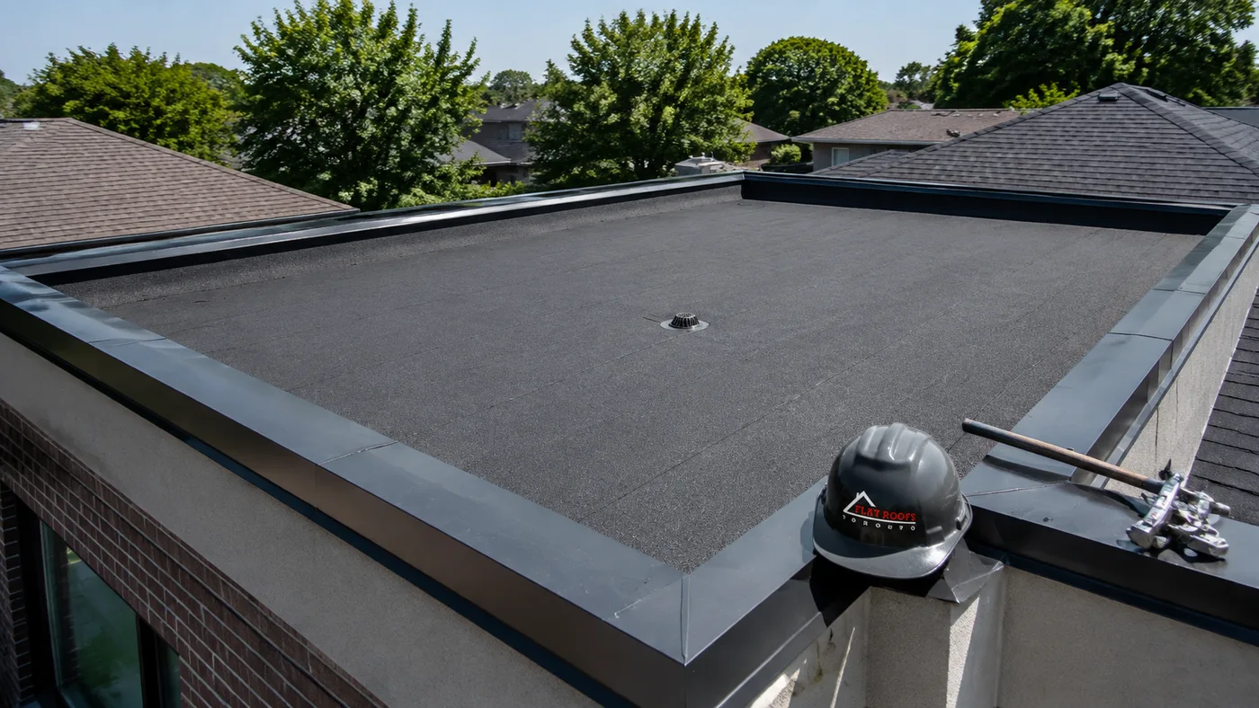 Newly completed flat roof replacement in Vaughan on a suburban two storey home in summer daylight