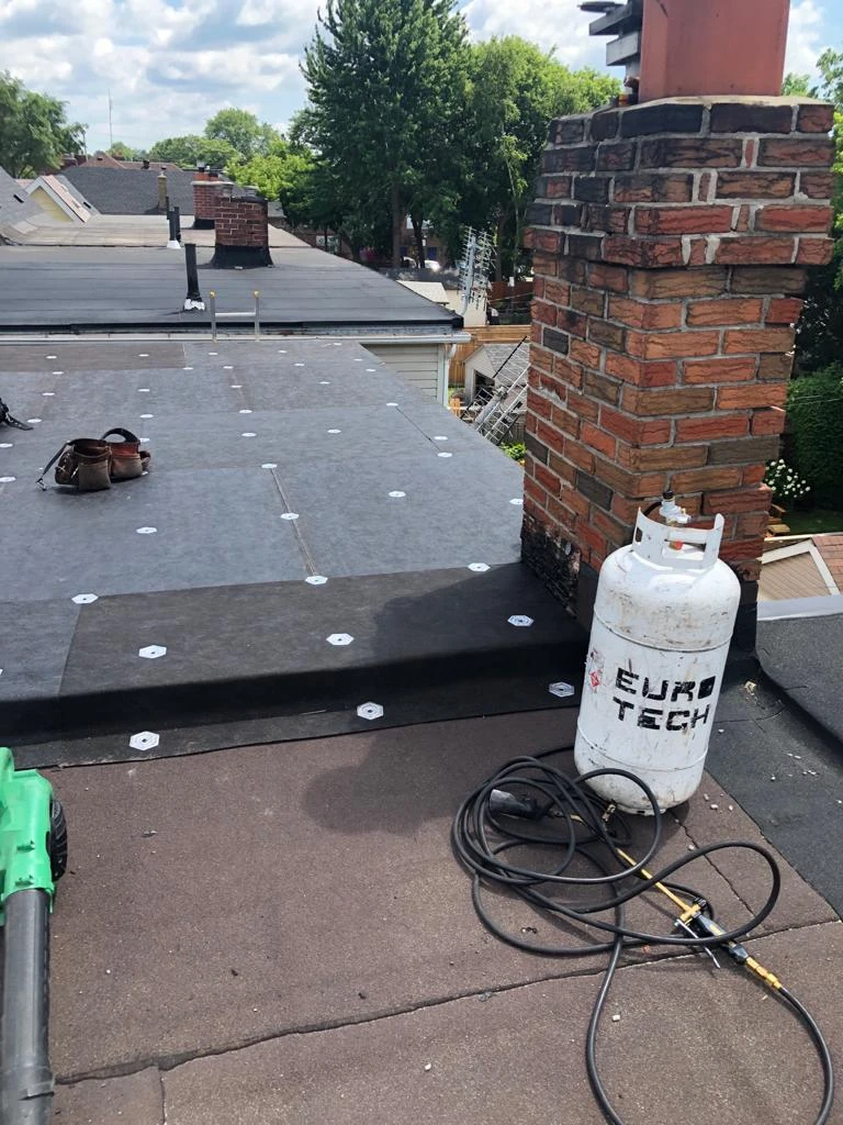 Two-ply modified bitumen torch-down membrane on a Toronto flat roof, view 13