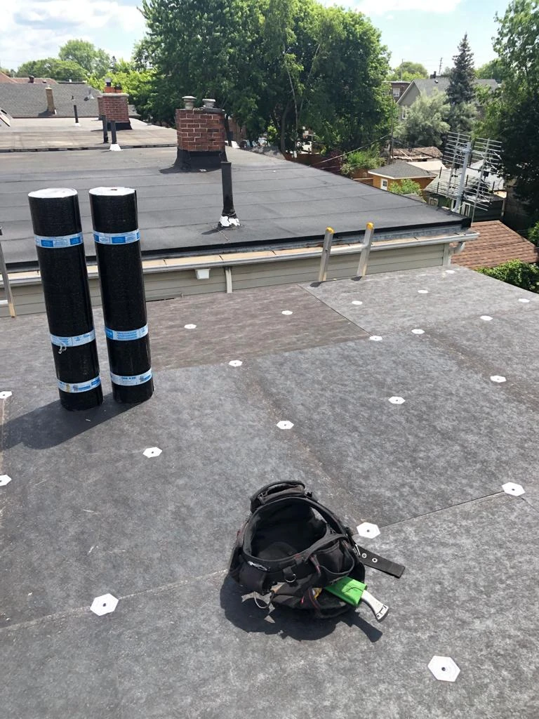 Two-ply modified bitumen torch-down membrane on a Toronto flat roof, view 17
