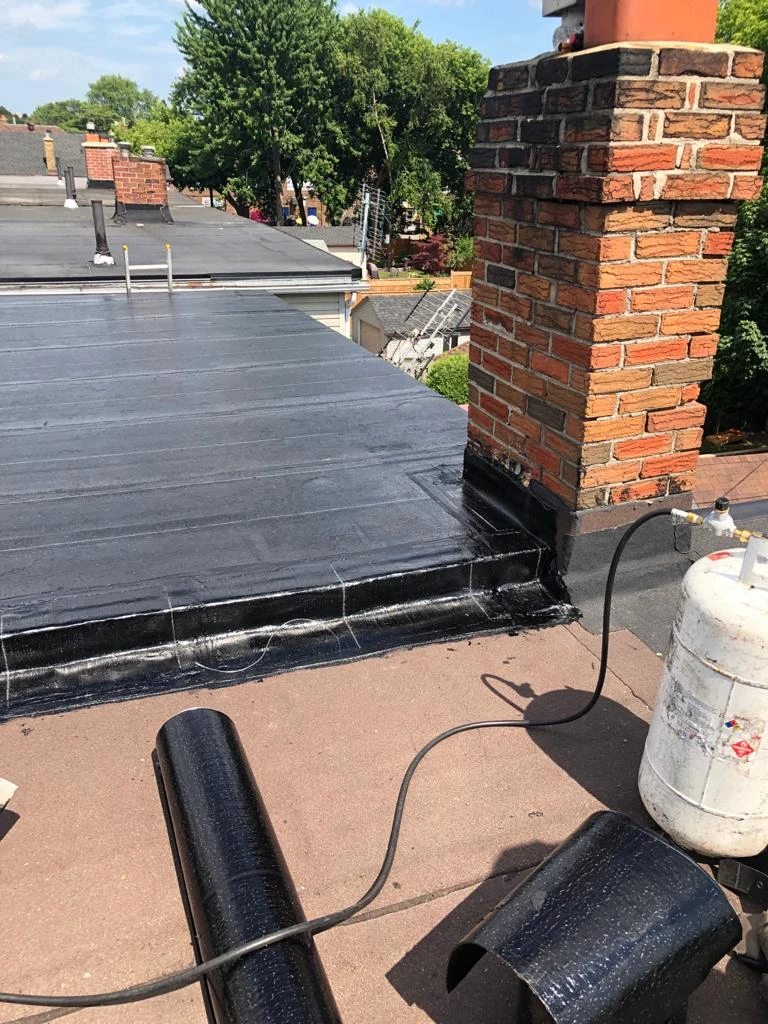 Two-ply modified bitumen torch-down membrane on a Toronto flat roof, view 19