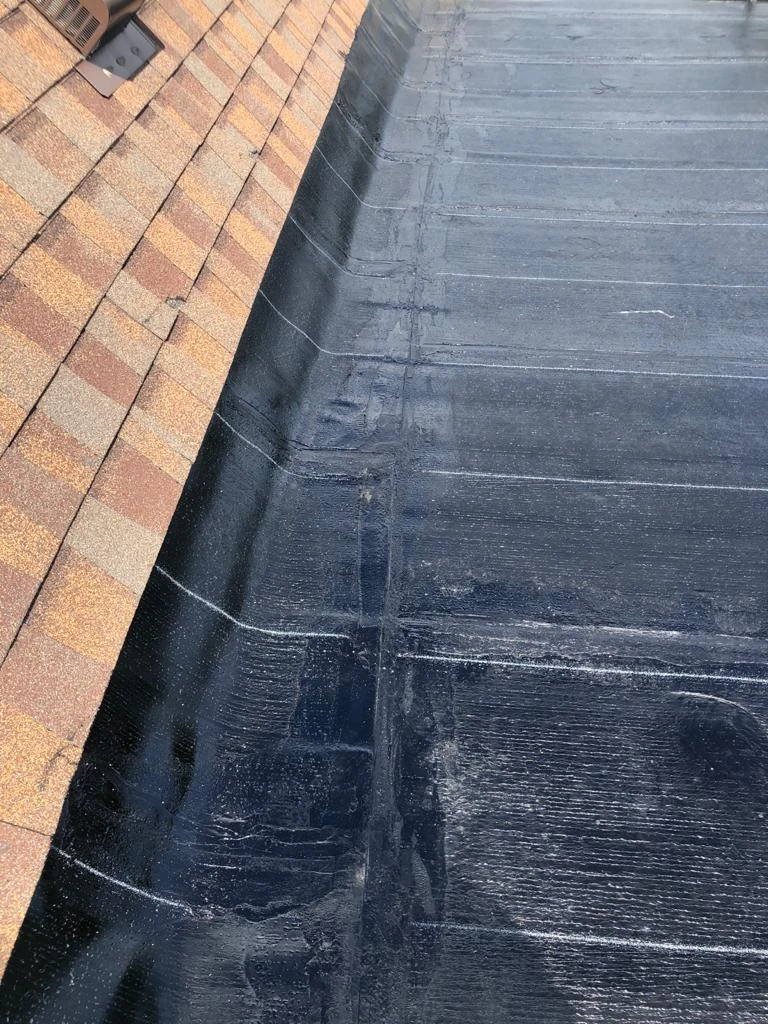 Two-ply modified bitumen torch-down membrane on a Toronto flat roof, view 23