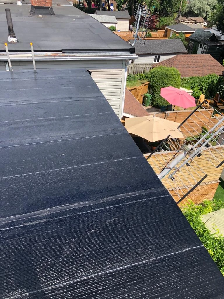 Two-ply modified bitumen torch-down membrane on a Toronto flat roof, view 24