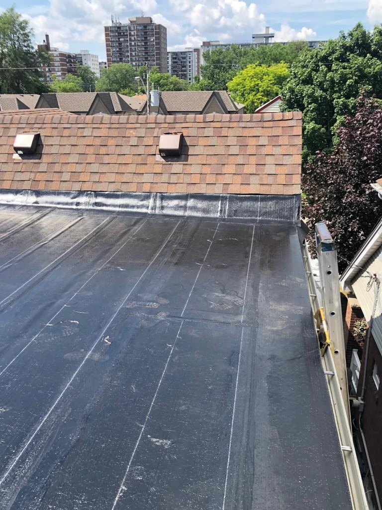 Two-ply modified bitumen torch-down membrane on a Toronto flat roof, view 25