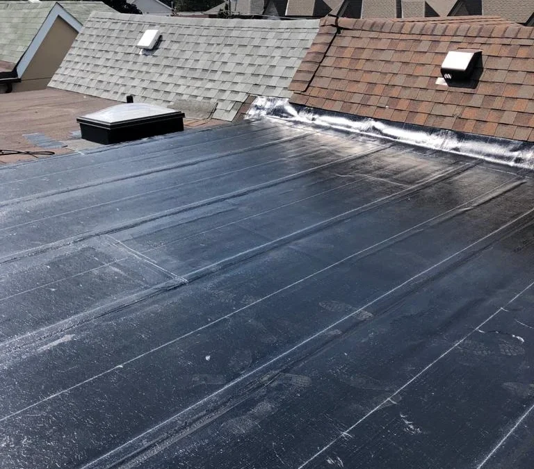 Flat Roof Ponding Water: Causes, Risks, Drainage Fixes and When It Means You Need a New Roof