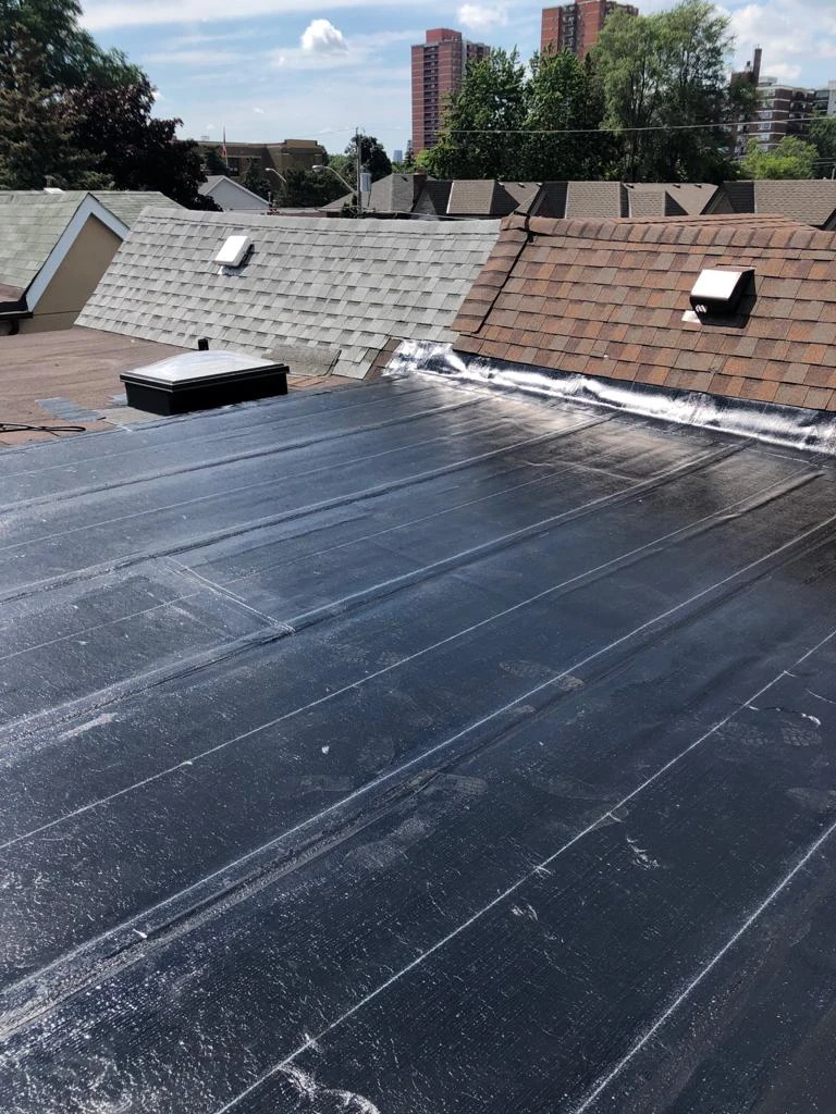 Two-ply modified bitumen torch-down membrane on a Toronto flat roof, view 27