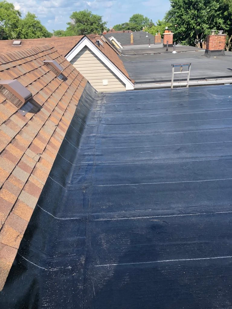 Lumbered slope framing built over a flat roof deck in Toronto, view 1