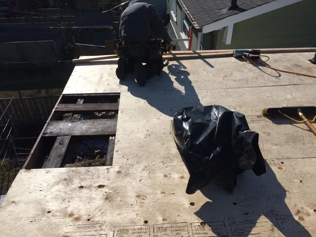 Attic inspection and blown-in insulation above a flat roof in Toronto, view 1