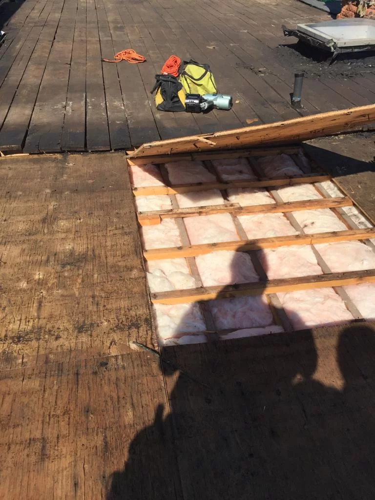 Attic inspection and blown-in insulation above a flat roof in Toronto, view 4