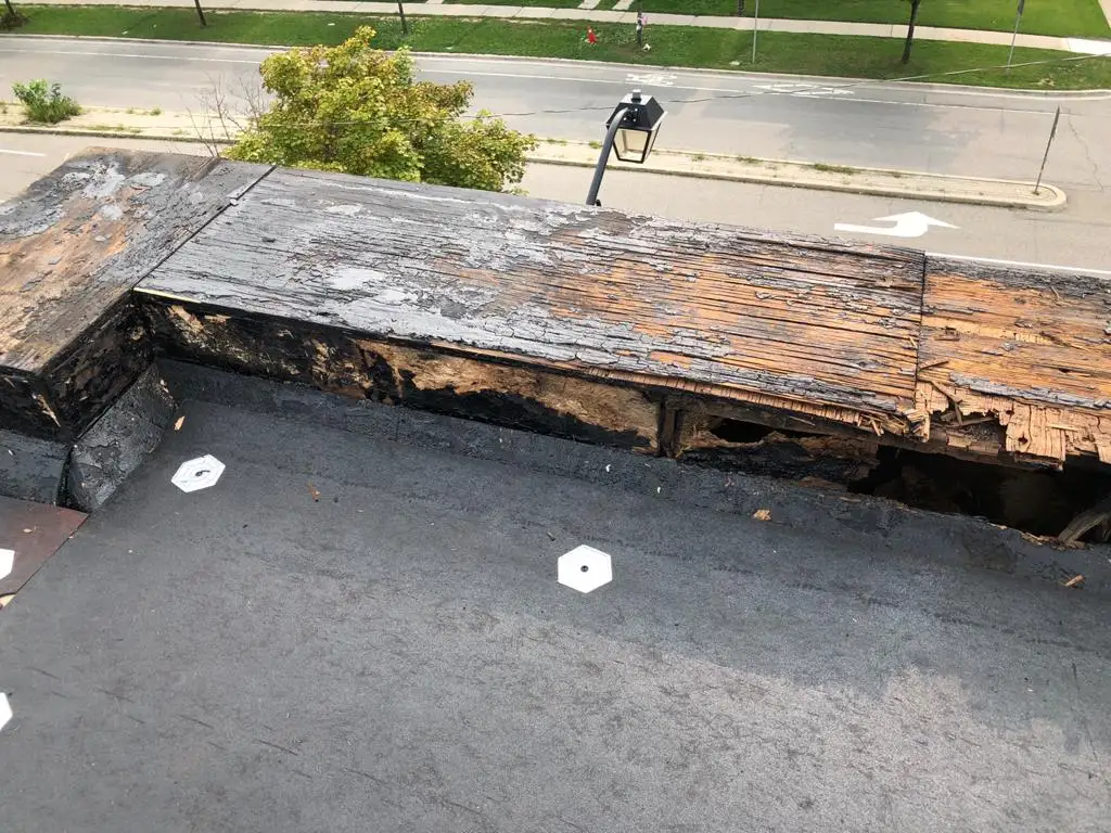 Parapet wall repair and reflashing on a Toronto flat roof, view 1