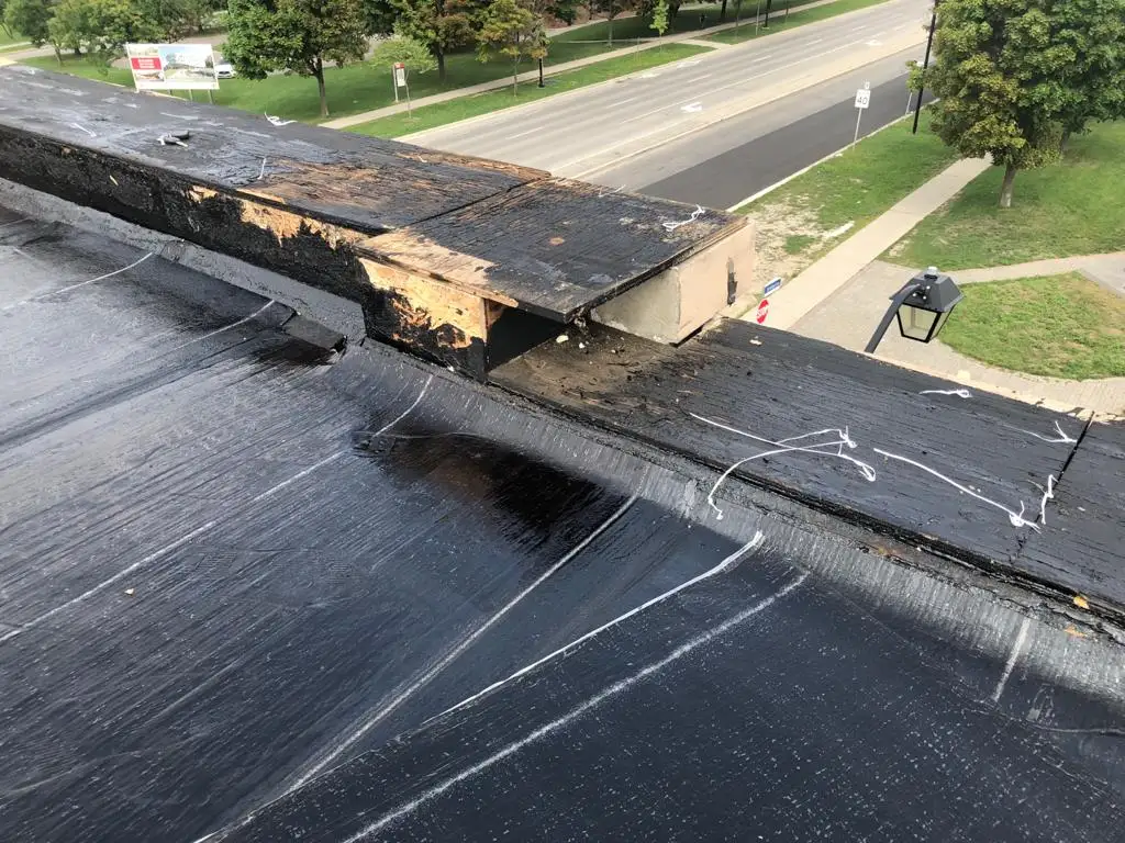Parapet wall repair and reflashing on a Toronto flat roof, view 3