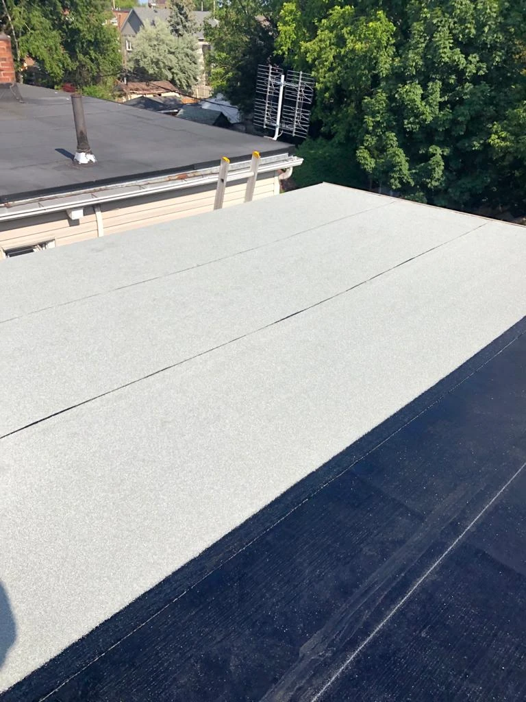 Flat Roofs Toronto roofing crew working on a flat roof, view 11