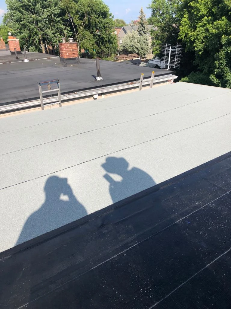 Flat Roofs Toronto roofing crew working on a flat roof, view 12