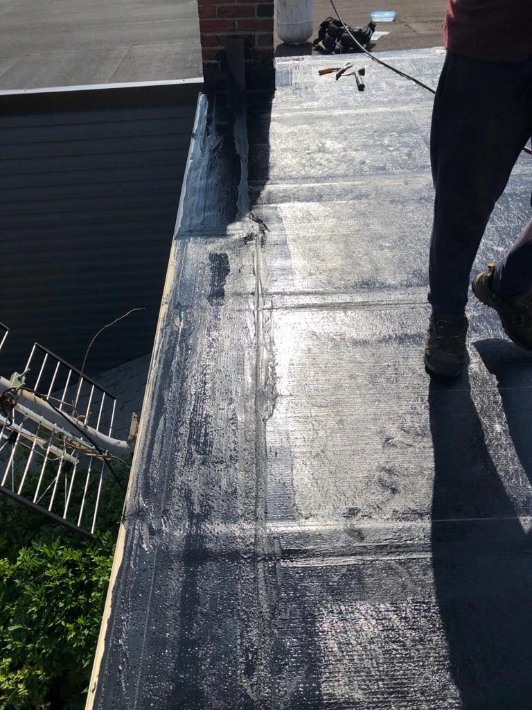 Flat Roofs Toronto roofing crew working on a flat roof, view 3