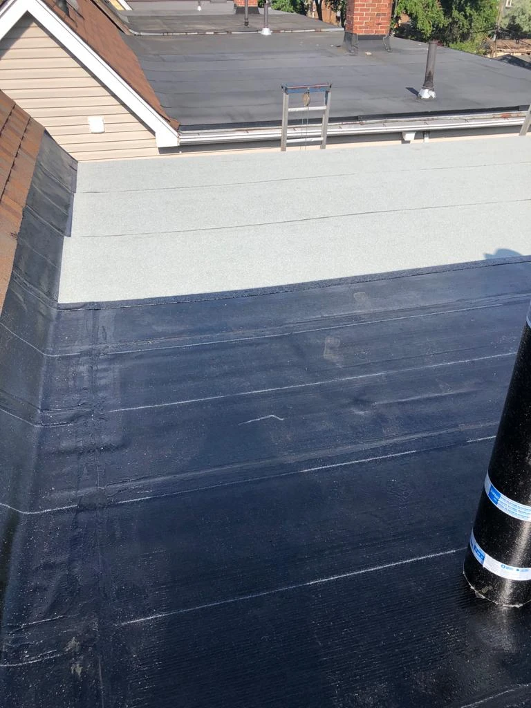 Flat Roofs Toronto roofing crew working on a flat roof, view 4