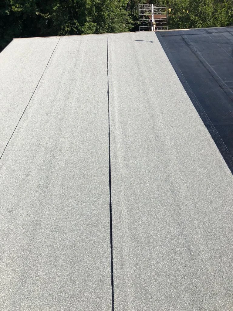Flat Roofs Toronto roofing crew working on a flat roof, view 5