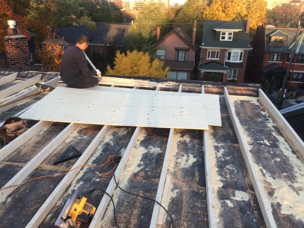 Flat Roofs Toronto roofing crew working on a flat roof, view 15