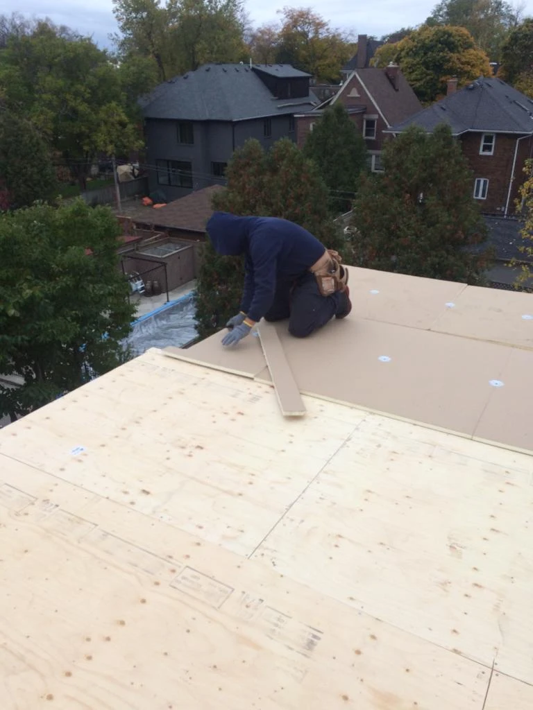 Flat Roofs Toronto roofing crew working on a flat roof, view 19