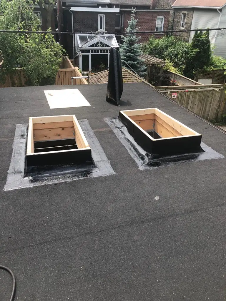 Skylight curb and flashing on a Toronto flat roof, view 1