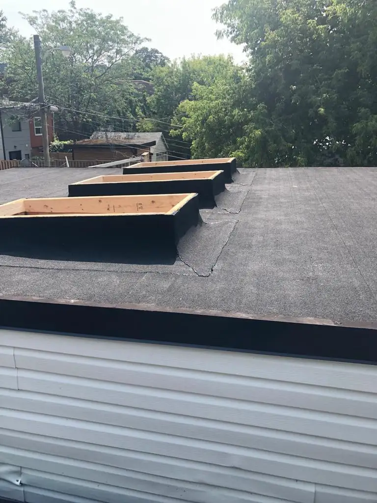 Skylight curb and flashing on a Toronto flat roof, view 10
