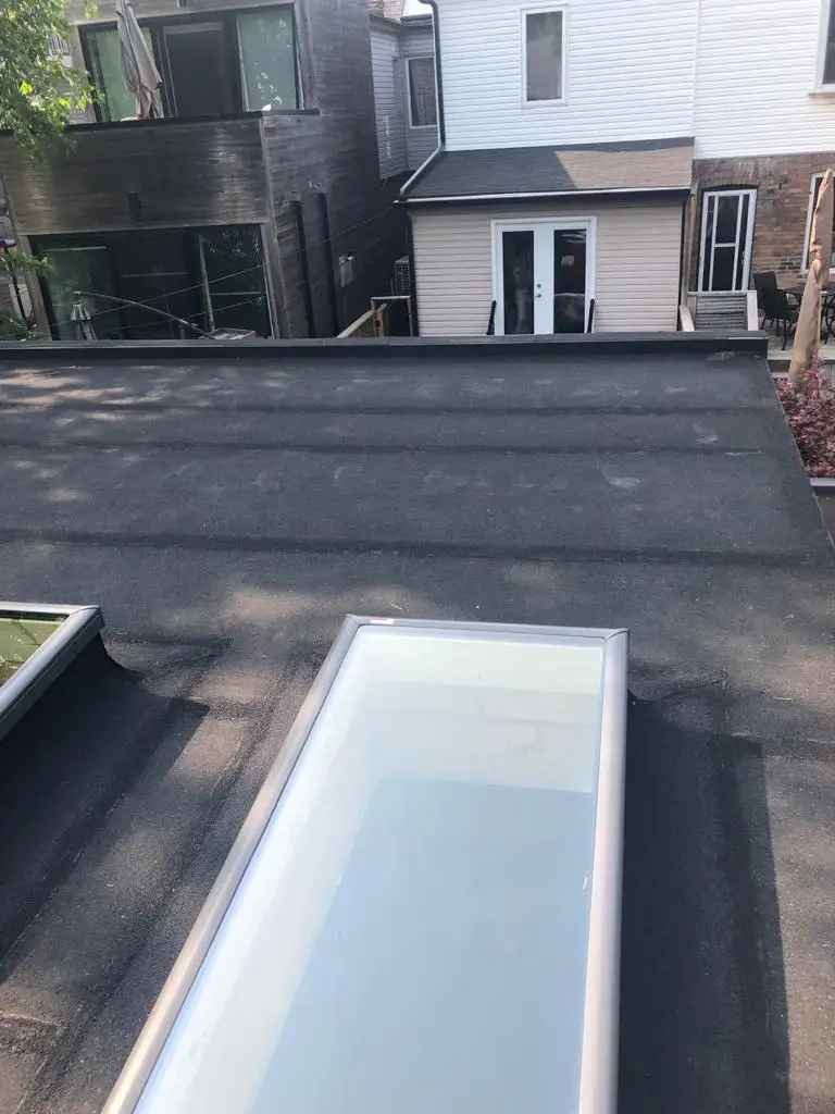Skylight curb and flashing on a Toronto flat roof, view 14