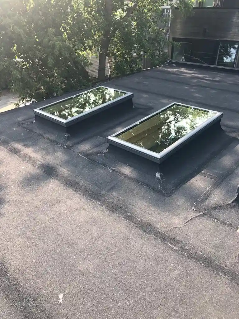 Skylight curb and flashing on a Toronto flat roof, view 16