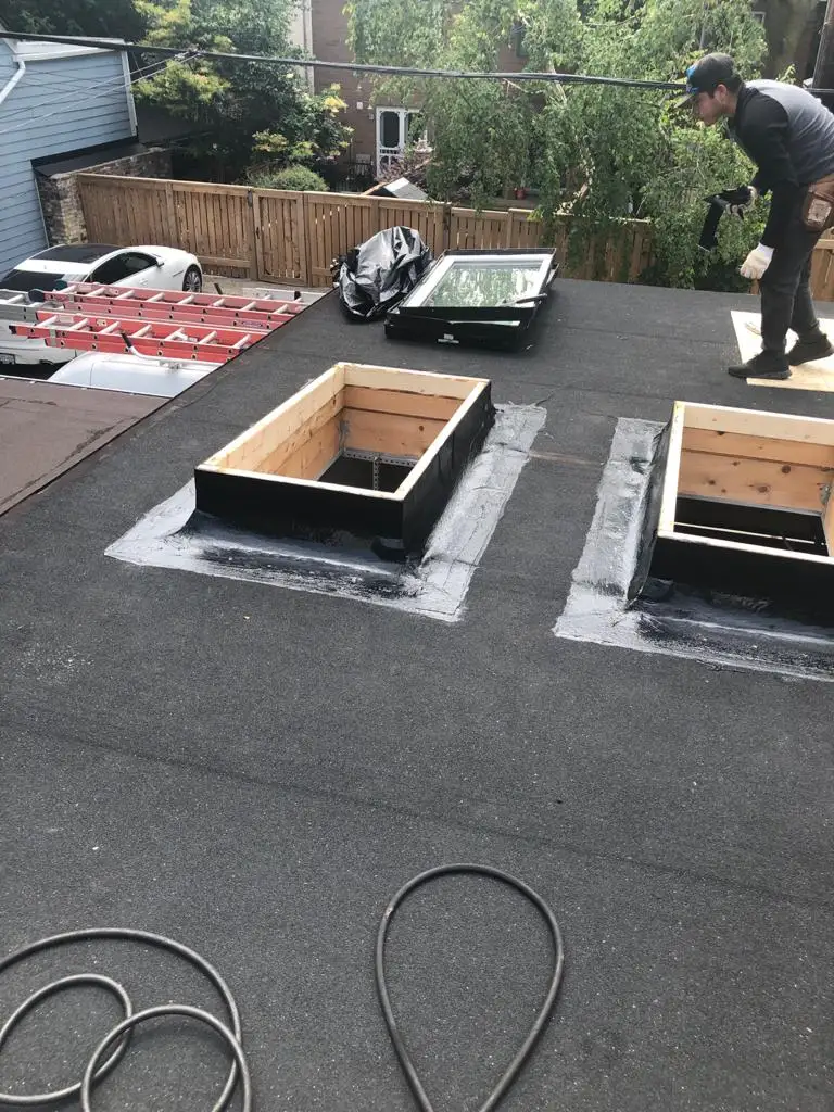 Skylight curb and flashing on a Toronto flat roof, view 17