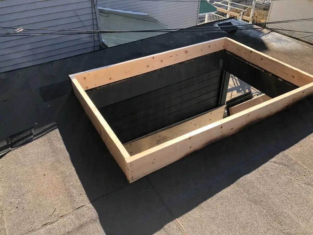 Skylight curb and flashing on a Toronto flat roof, view 18