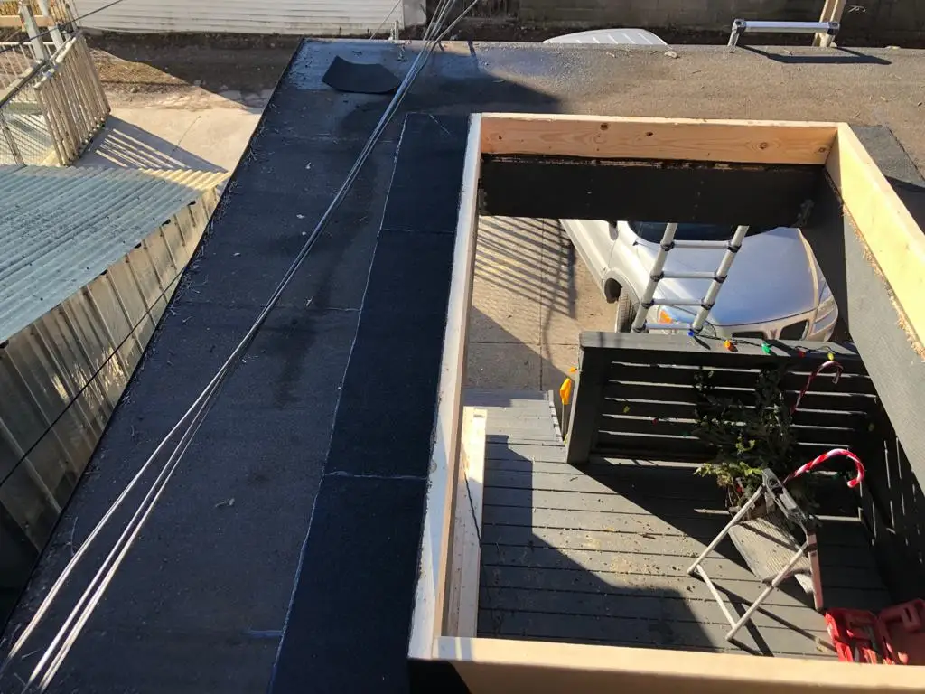 Skylight curb and flashing on a Toronto flat roof, view 19