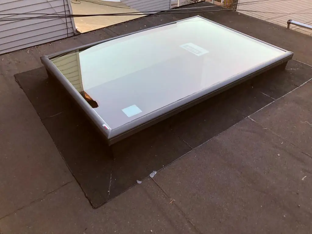 Skylight curb and flashing on a Toronto flat roof, view 21