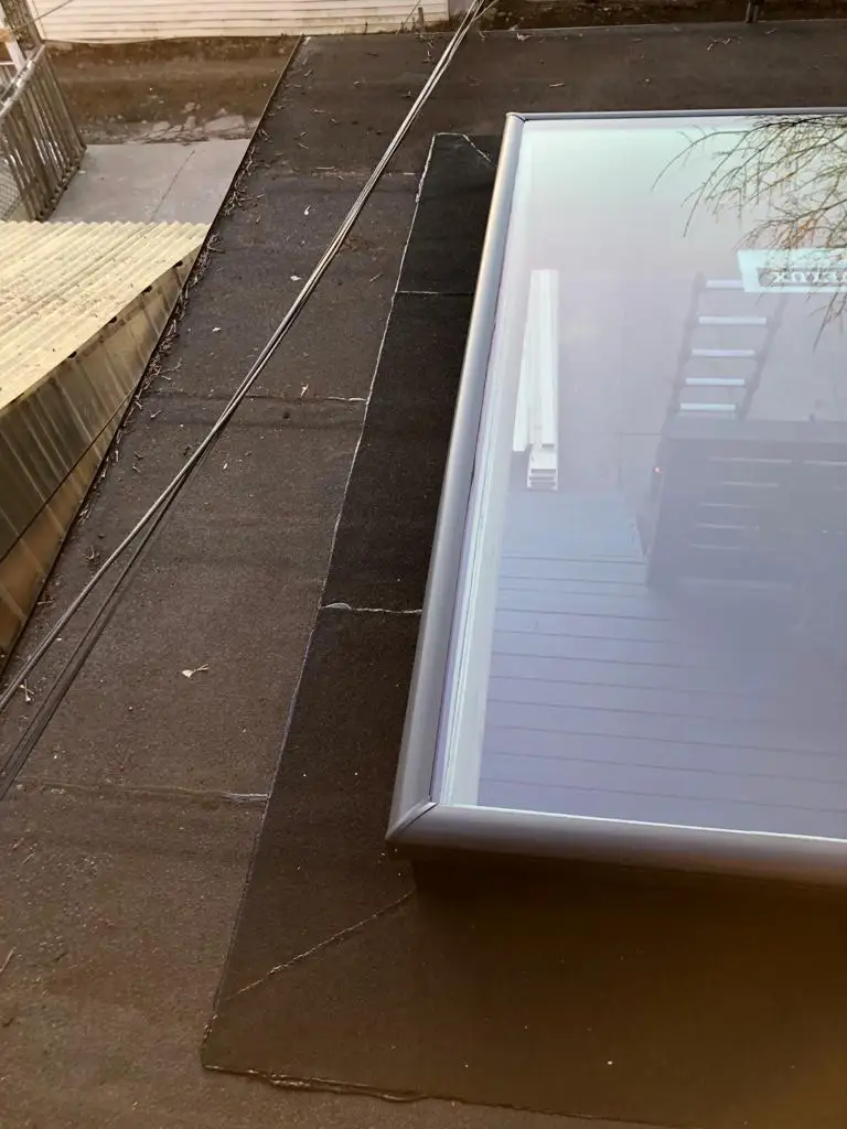 Skylight curb and flashing on a Toronto flat roof, view 23