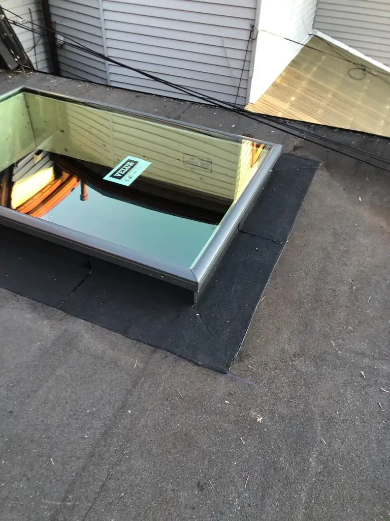 Skylight curb and flashing on a Toronto flat roof, view 24
