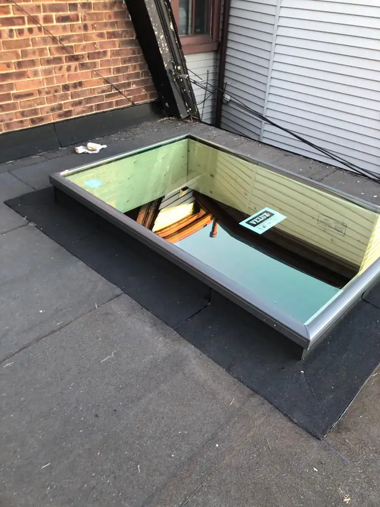 Skylight curb and flashing on a Toronto flat roof, view 25