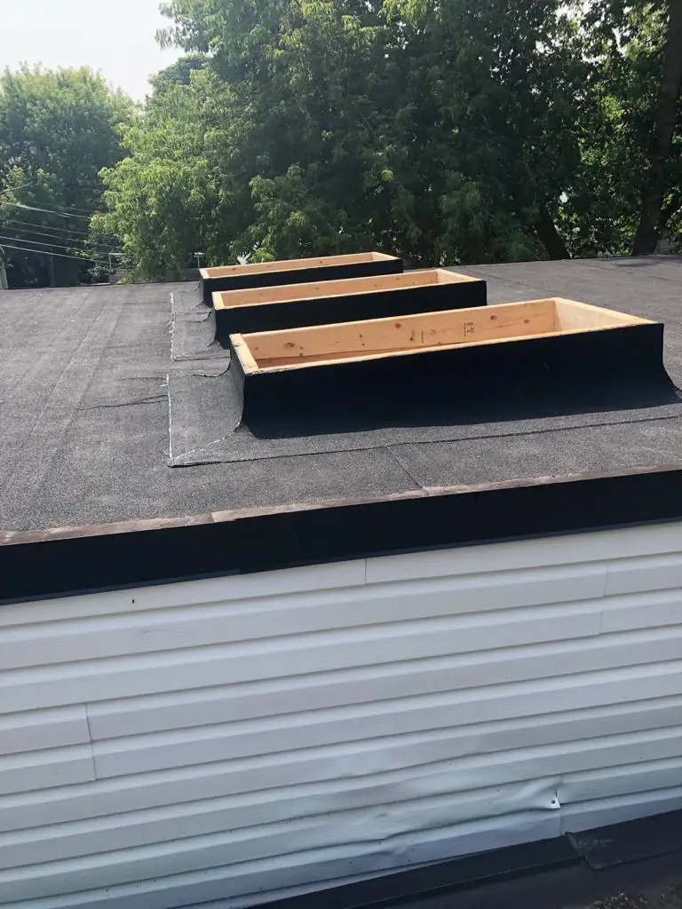 Skylight curb and flashing on a Toronto flat roof, view 9