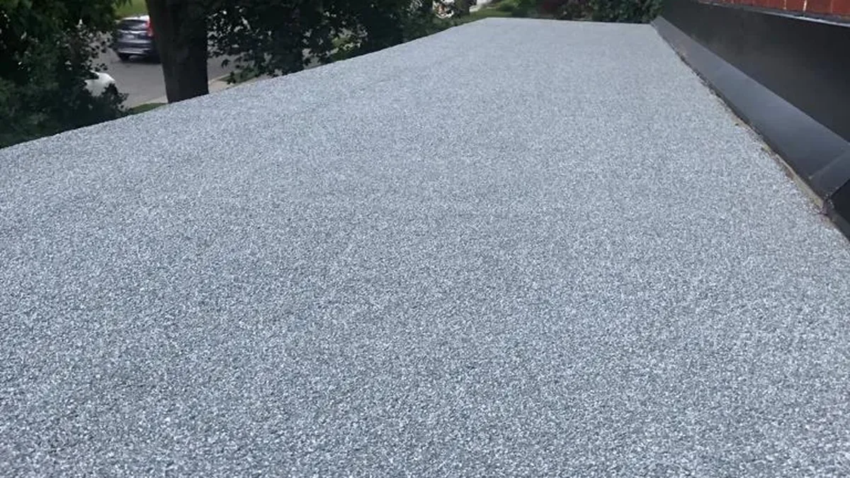 Cold-ply flat roof finished with a ceramic granule surface on a Toronto building